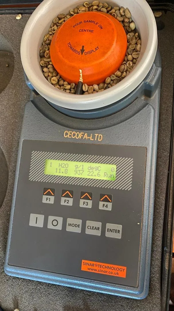 Moisture testing coffee at the quality lab