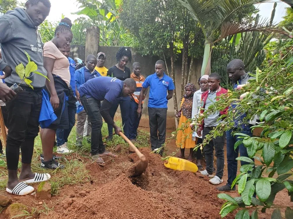 Farmers planting trees in a coffee-growing community